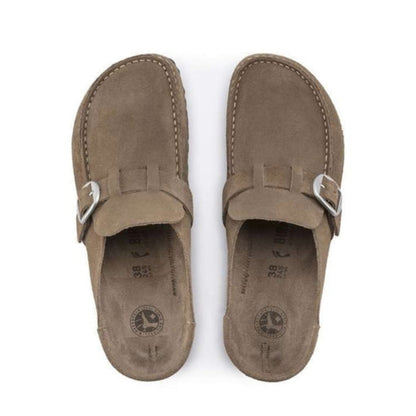 Slip-on clog featuring a structured upper, adjustable buckle strap, contoured cork-latex footbed, and durable outsole for everyday comfort and casual wear
