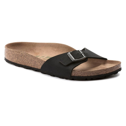 Minimalist single-strap sandal featuring an adjustable buckle, contoured cork-latex footbed, and lightweight open design for everyday comfort and casual wear