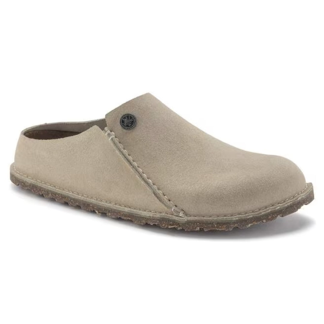 Premium suede slipper featuring a closed-toe slip-on design, contoured cork-latex footbed, and soft construction for comfortable indoor and casual wear