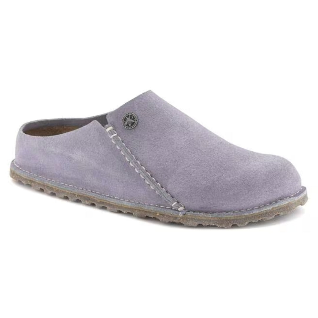 Suede slip-on slipper featuring a closed-toe design, contoured cork-latex footbed, soft interior, and comfortable construction for everyday indoor wear