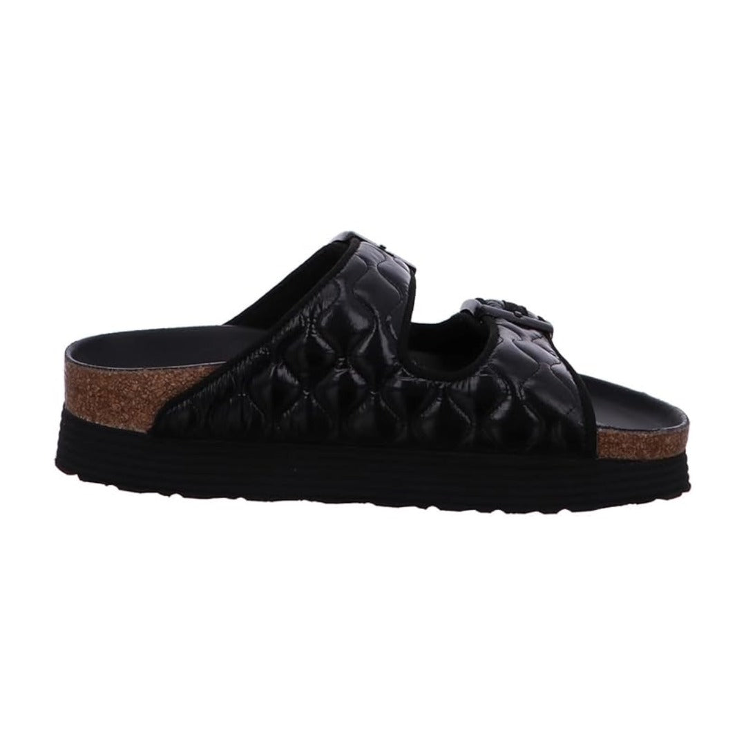 Platform sandal featuring padded dual straps, adjustable buckles, a contoured cork-latex footbed, and a black elevated sole for stylish everyday comfort