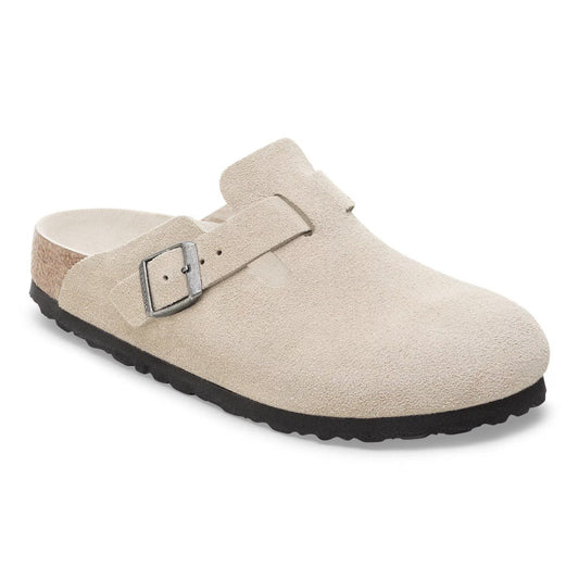 Women wearing Birkenstock Boston Soft Footbed clogs, closed-toe suede slip-on shoes with buckle strap and cushioned cork footbed, styled for casual everyday wear.