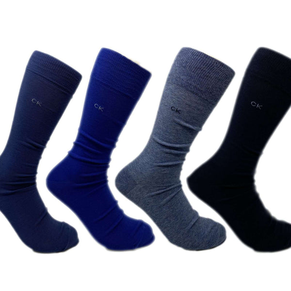 Set of Calvin Klein men’s dress socks featuring a smooth combed cotton finish, ribbed cuffs, and a classic crew length for formal wear.