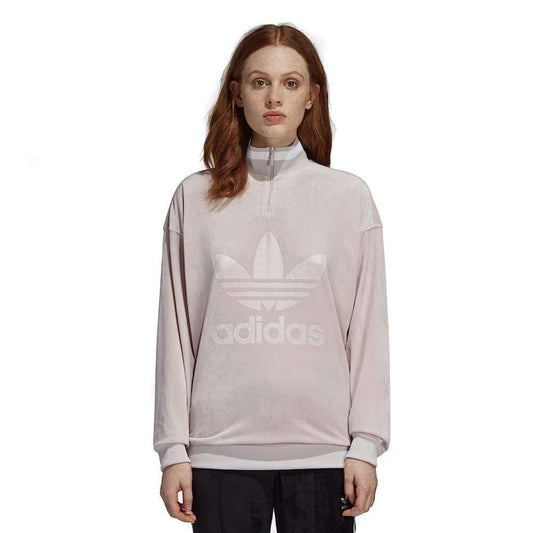 A woman wearing adidas Women's Originals Zip Sweatshirt