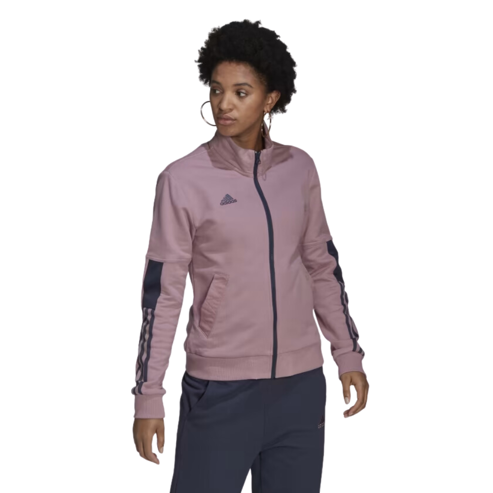 Adidas Women's Tiro Jacket in Magic Mauve, inspired by soccer fan culture and made with 100% cotton French terry.