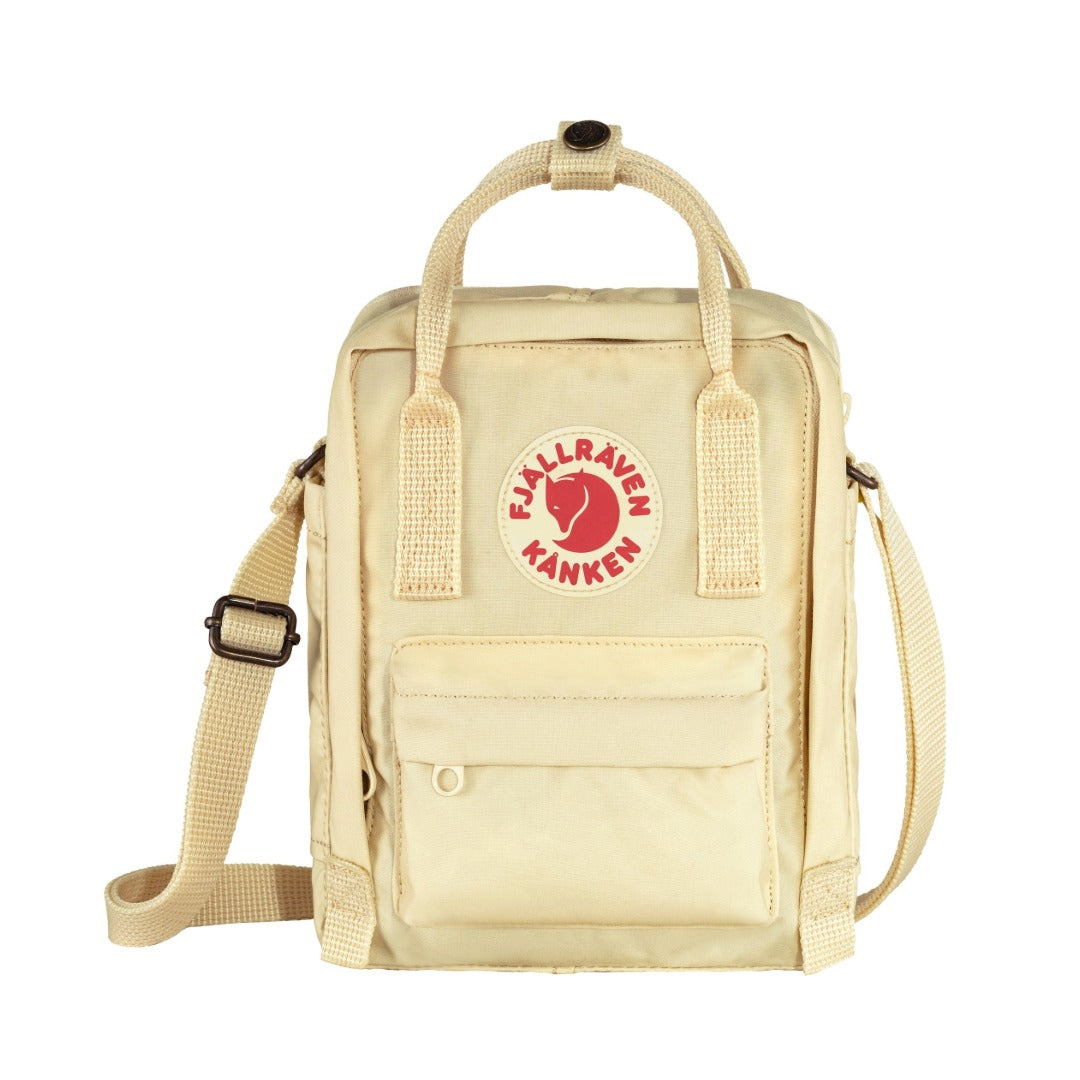 Fjällräven Kånken Sling bag with a compact rectangular shape, adjustable crossbody strap, top handles, and front zip pocket, styled for everyday casual carry