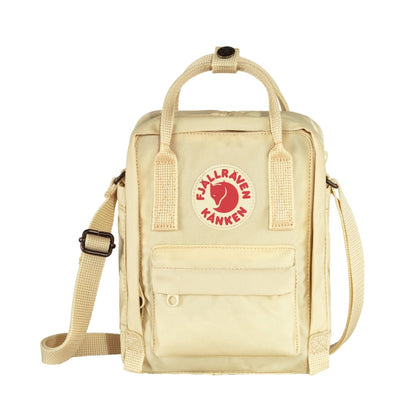 Fjällräven Kånken Sling bag with a compact rectangular shape, adjustable crossbody strap, top handles, and front zip pocket, styled for everyday casual carry