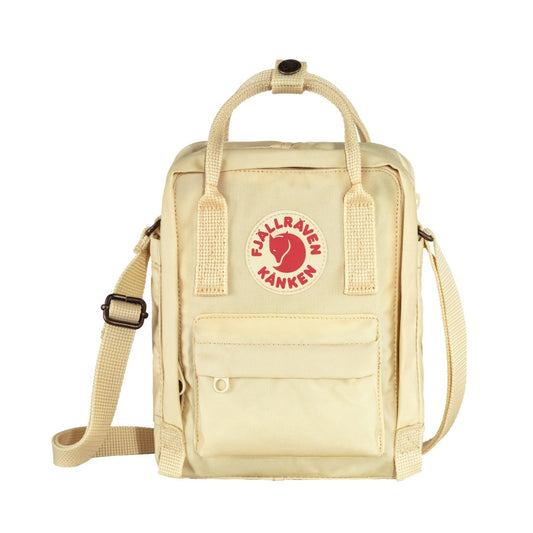 Fjällräven Kånken Sling bag with a compact rectangular shape, adjustable crossbody strap, top handles, and front zip pocket, styled for everyday casual carry