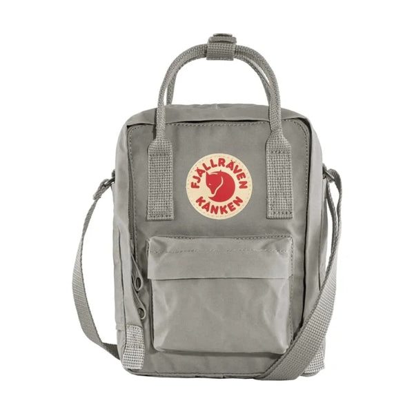 Fjällräven Kånken Sling bag with a compact rectangular shape, adjustable crossbody strap, top handles, and front zip pocket, styled for everyday casual carry