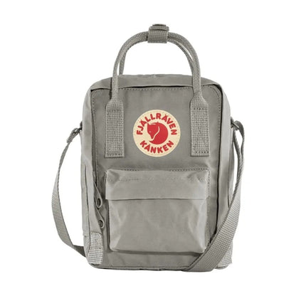 Fjällräven Kånken Sling bag with a compact rectangular shape, adjustable crossbody strap, top handles, and front zip pocket, styled for everyday casual carry