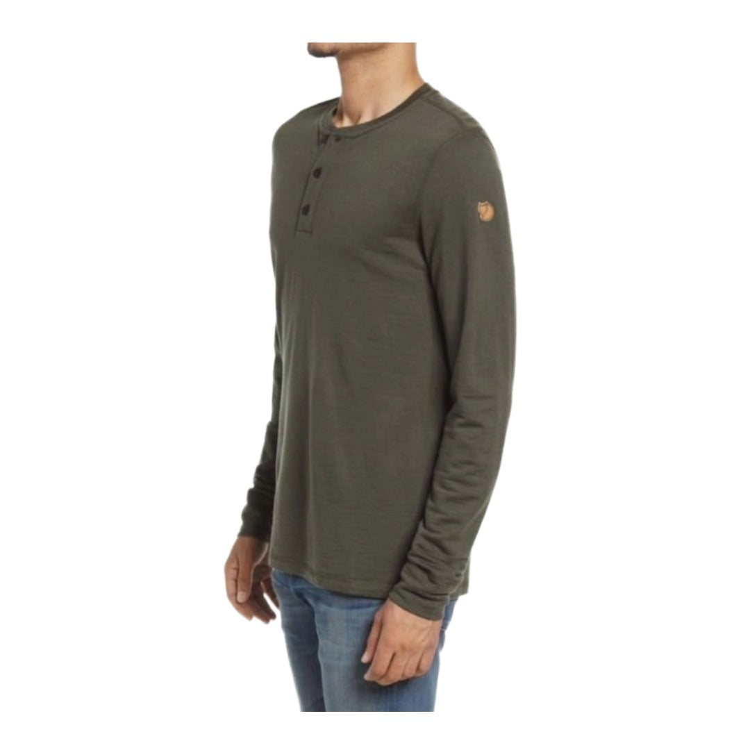 Fjällräven merino wool henley long sleeve shirt with button neckline, lightweight base-layer design, worn for outdoor or casual cold-weather comfort