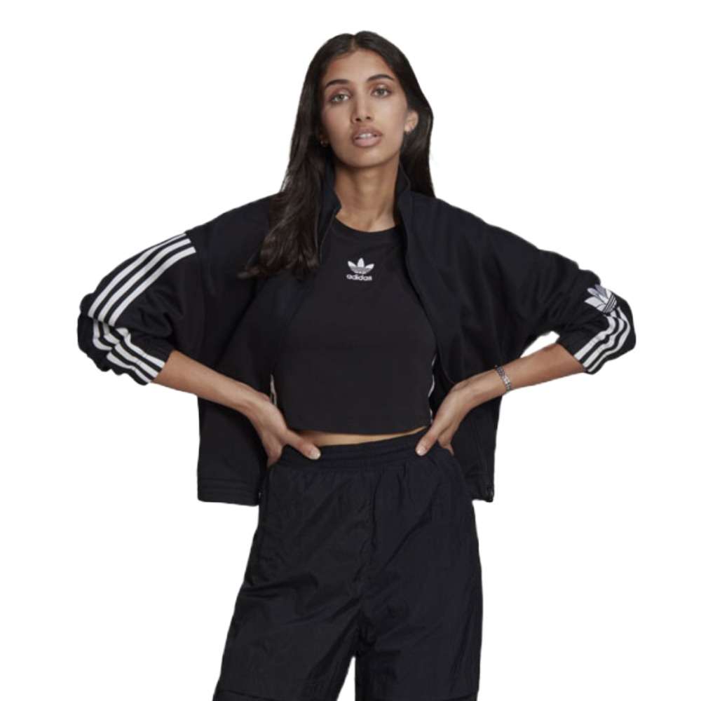 A person wearing the adidas Originals 3-D Trefoil Track Top