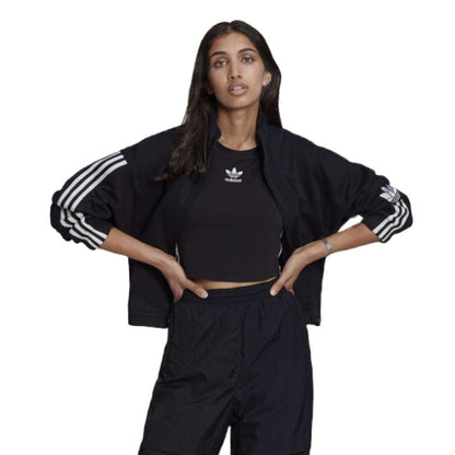 A person wearing the adidas Originals 3-D Trefoil Track Top