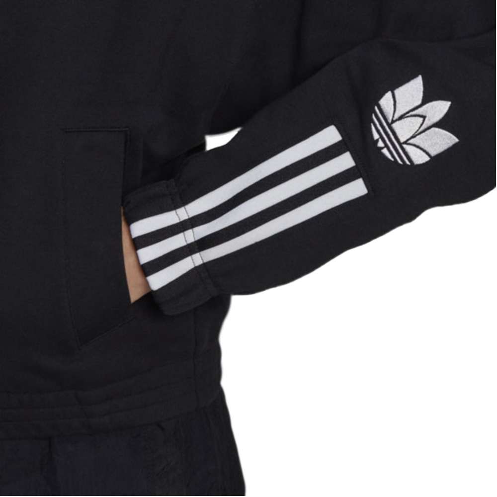 A person wearing the adidas Originals 3-D Trefoil Track Top