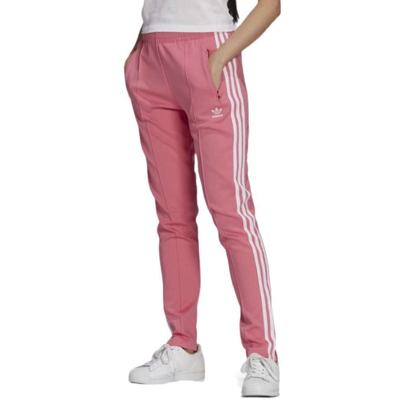 A woman wearing the adidas Originals Women's Primeblue Superstar Track Pants