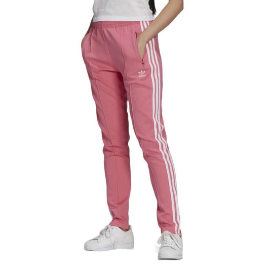 A woman wearing the adidas Originals Women's Primeblue Superstar Track Pants