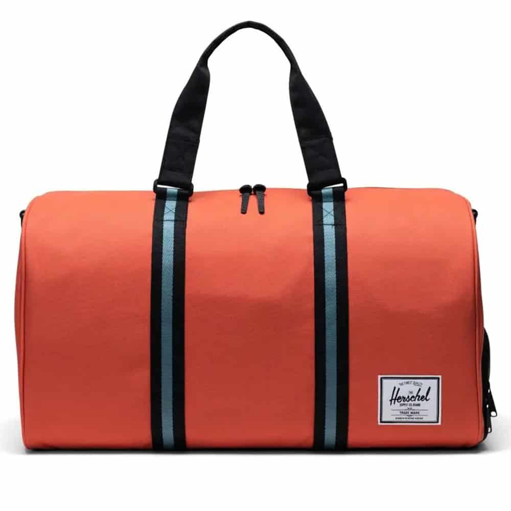 Herschel Novel duffle bag with a spacious main compartment, side shoe pocket, and dual carry handles, designed for travel and gym use.