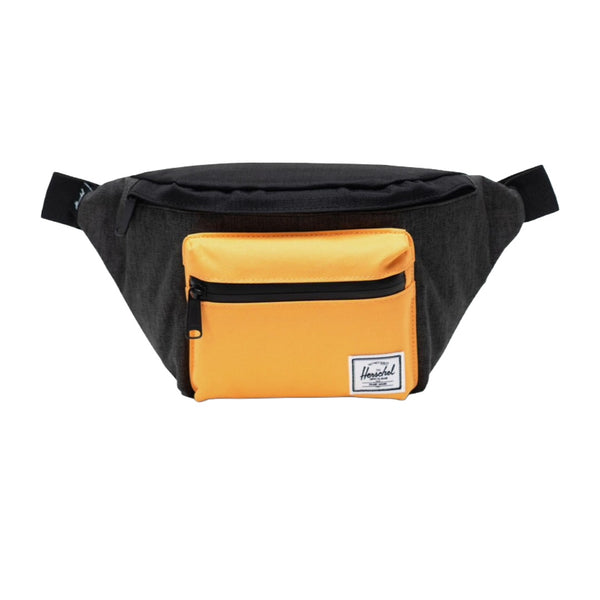 Herschel Seventeen hip pack worn crossbody, featuring a compact design with dual zippered compartments and adjustable strap for everyday use.
