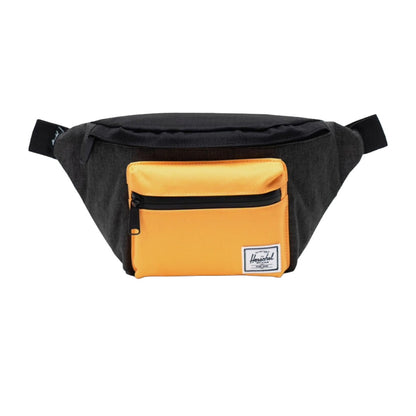 Herschel Seventeen hip pack worn crossbody, featuring a compact design with dual zippered compartments and adjustable strap for everyday use.