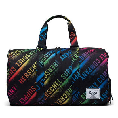 Herschel Novel duffle bag with a spacious main compartment, side shoe pocket, and dual carry handles, designed for travel and gym use.