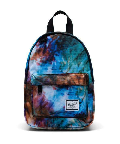 Herschel Classic Mini backpack with a small, minimalist design, front zip pocket, and adjustable straps for casual everyday use.