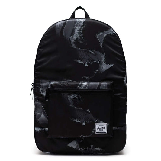 Herschel packable daypack folded and unfolded, showing a lightweight backpack design with adjustable straps and compact storage capability.