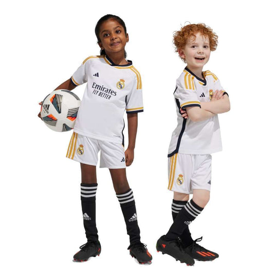Kid wearing Real Madrid 23/24 Home Mini Kit