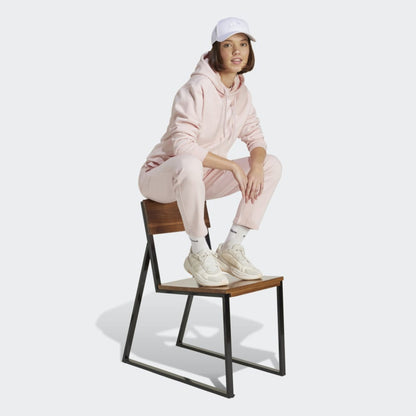 adidas Women's Essentials Small Logo Feel Cozy Hoodie in a relaxed fit, perfect for comfort and style.