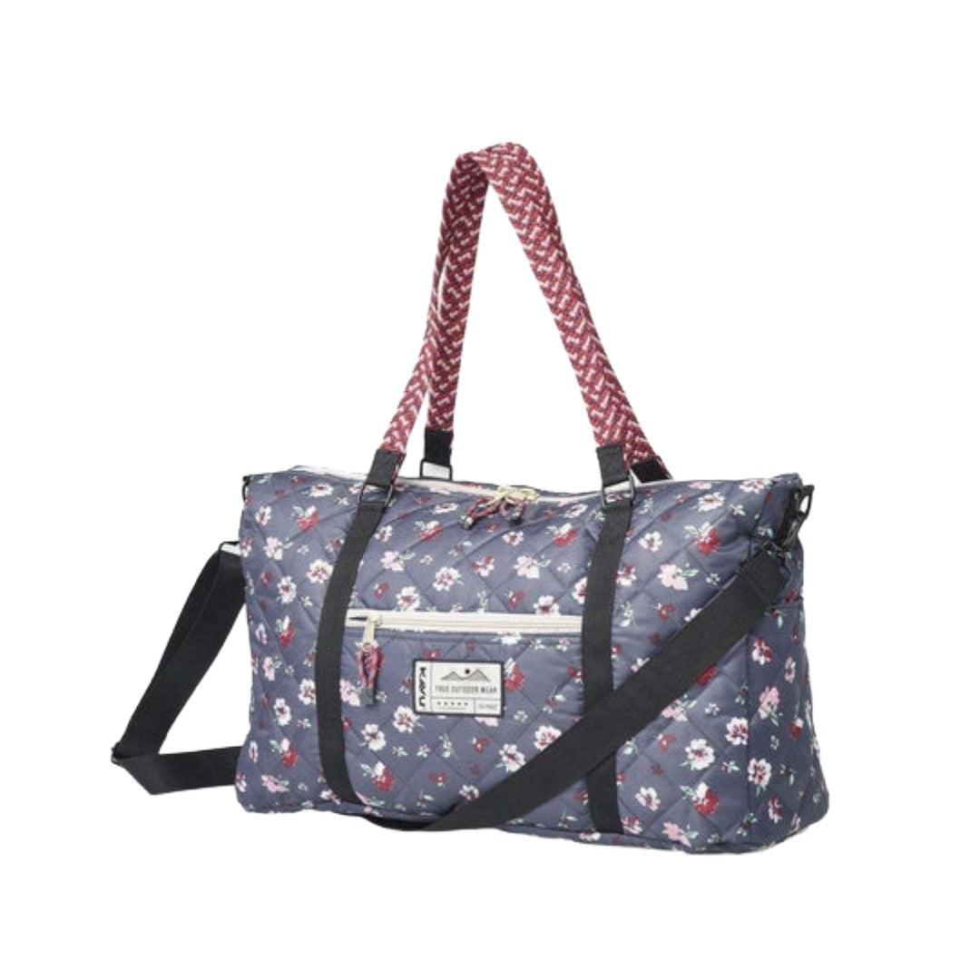 Quilted duffel bag featuring a puffer-style exterior, dual carry handles, spacious zippered main compartment, and lightweight construction for travel and everyday use