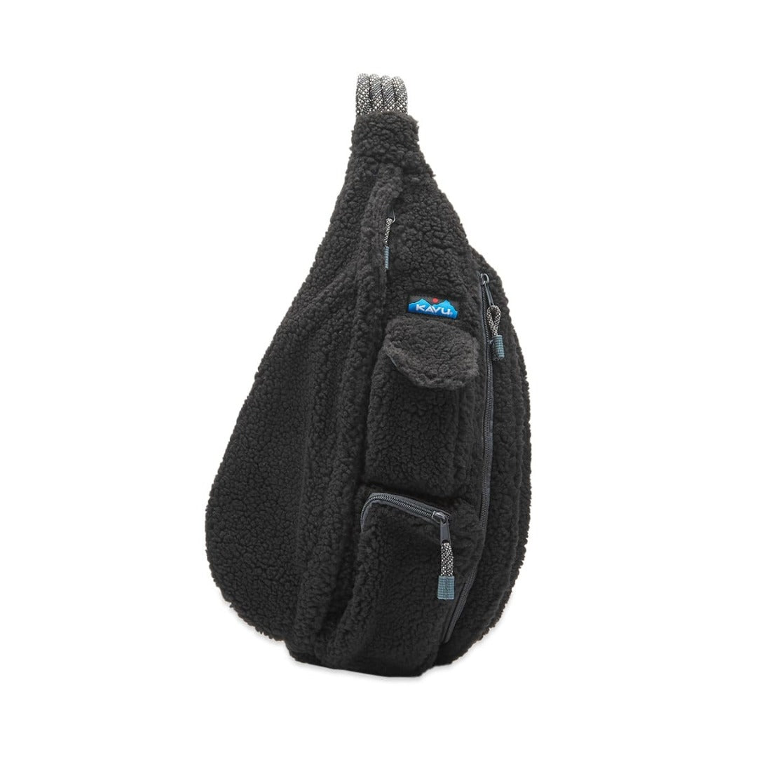 Fleece sling bag featuring a soft textured exterior, rope shoulder strap, multiple zippered compartments, and a lightweight crossbody design for everyday carry