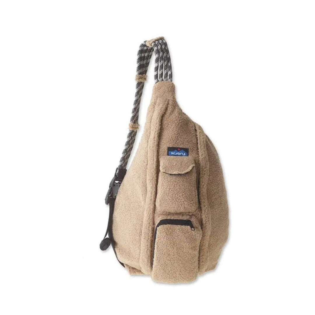 Fleece sling bag featuring a soft textured exterior, rope shoulder strap, multiple zippered compartments, and a lightweight crossbody design for everyday carry