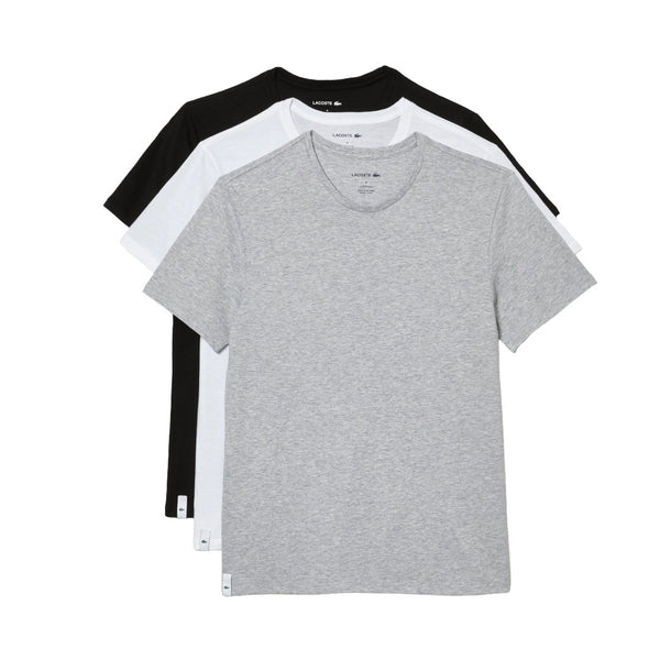 Set of men’s white crew neck undershirts made from soft cotton, featuring short sleeves and a regular fit for everyday layering.