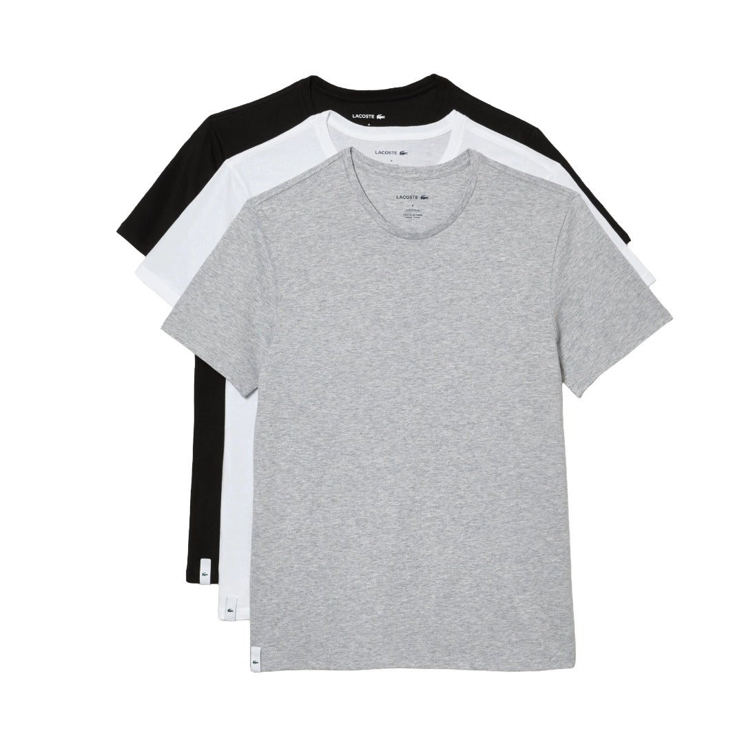 Set of men’s white crew neck undershirts made from soft cotton, featuring short sleeves and a regular fit for everyday layering.
