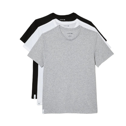 Set of men’s white crew neck undershirts made from soft cotton, featuring short sleeves and a regular fit for everyday layering.