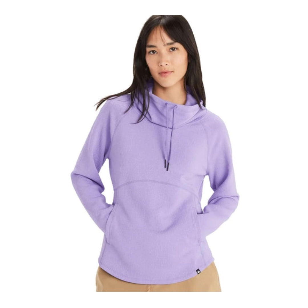 Woman wearing Marmot Annie long-sleeve top with cowl neck and kangaroo pocket, featuring soft performance fabric and a relaxed fit for casual outdoor wear