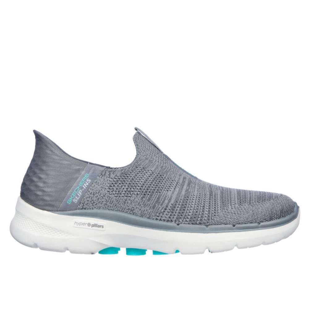 A pair of Skechers Women's Slip-ons Go Walk 6 in gray. The shoes feature a slip-on design and a comfortable, cushioned sole. The Skechers logo is visible on the side of each shoe.