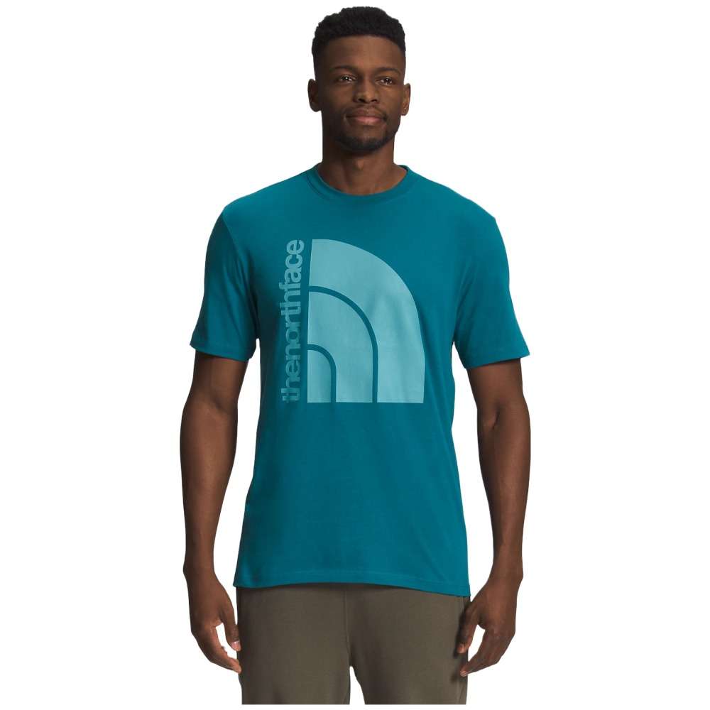 A man wearing The North Face Men's Short-Sleeve Jumbo Half Dome Tee.