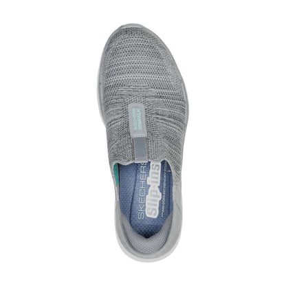 A pair of Skechers Women's Slip-ons Go Walk 6 in gray. The shoes feature a slip-on design and a comfortable, cushioned sole. The Skechers logo is visible on the side of each shoe.