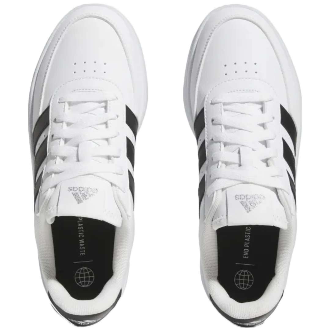 A pair of adidas Breaknet 2.0 sneakers for women in white with black strips. The sneakers feature a leather and synthetic upper, a rubber outsole, and the adidas logo on the side.