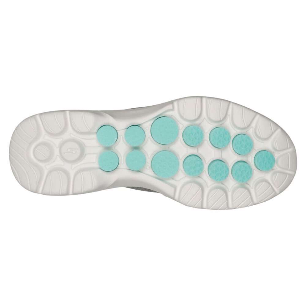 A pair of Skechers Women's Slip-ons Go Walk 6 in gray. The shoes feature a slip-on design and a comfortable, cushioned sole. The Skechers logo is visible on the side of each shoe.