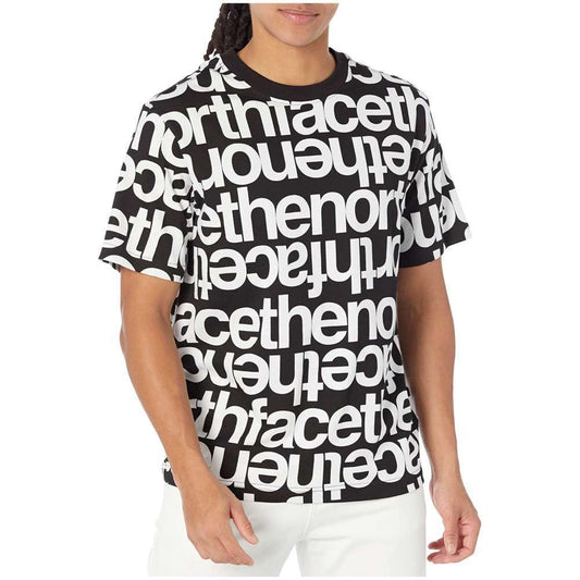 A man wearing The North Face Men's Short-Sleeve All Over Print Box Fit Tee.