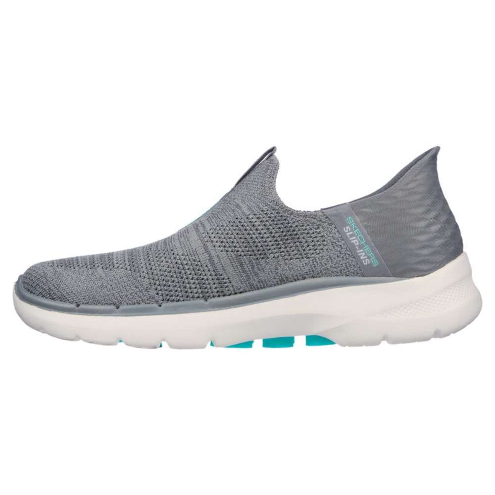 A pair of Skechers Women's Slip-ons Go Walk 6 in gray. The shoes feature a slip-on design and a comfortable, cushioned sole. The Skechers logo is visible on the side of each shoe.