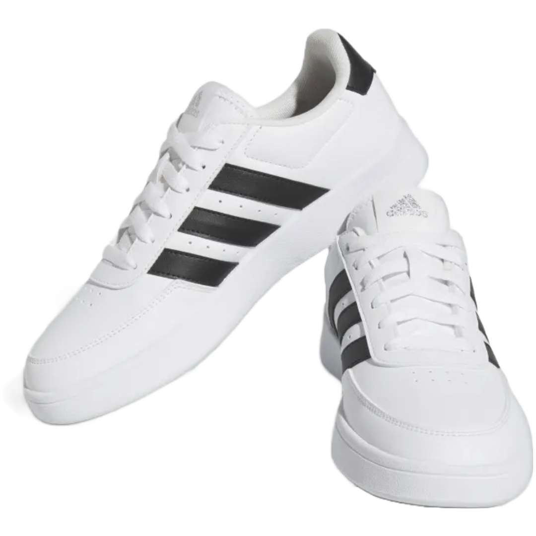 A pair of adidas Breaknet 2.0 sneakers for women in white with black strips. The sneakers feature a leather and synthetic upper, a rubber outsole, and the adidas logo on the side.