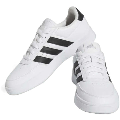 A pair of adidas Breaknet 2.0 sneakers for women in white with black strips. The sneakers feature a leather and synthetic upper, a rubber outsole, and the adidas logo on the side.
