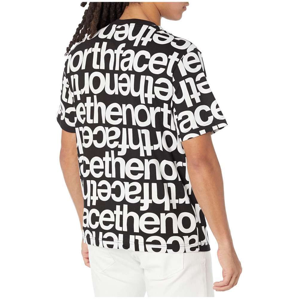 A man wearing The North Face Men's Short-Sleeve All Over Print Box Fit Tee.