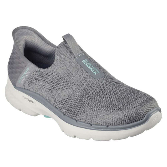 A pair of Skechers Women's Slip-ons Go Walk 6 in gray. The shoes feature a slip-on design and a comfortable, cushioned sole. The Skechers logo is visible on the side of each shoe.