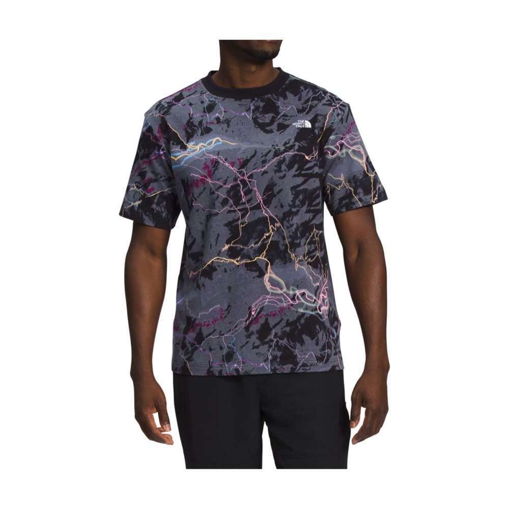 A man wearing The North Face Men's Short-Sleeve All Over Print Box Fit Tee.