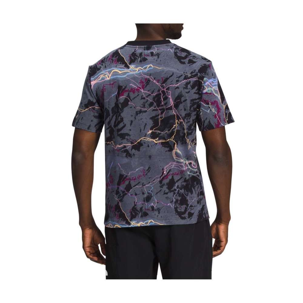A man wearing The North Face Men's Short-Sleeve All Over Print Box Fit Tee.