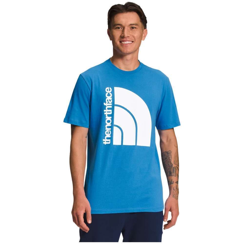 A man wearing The North Face Men's Short-Sleeve Jumbo Half Dome Tee.