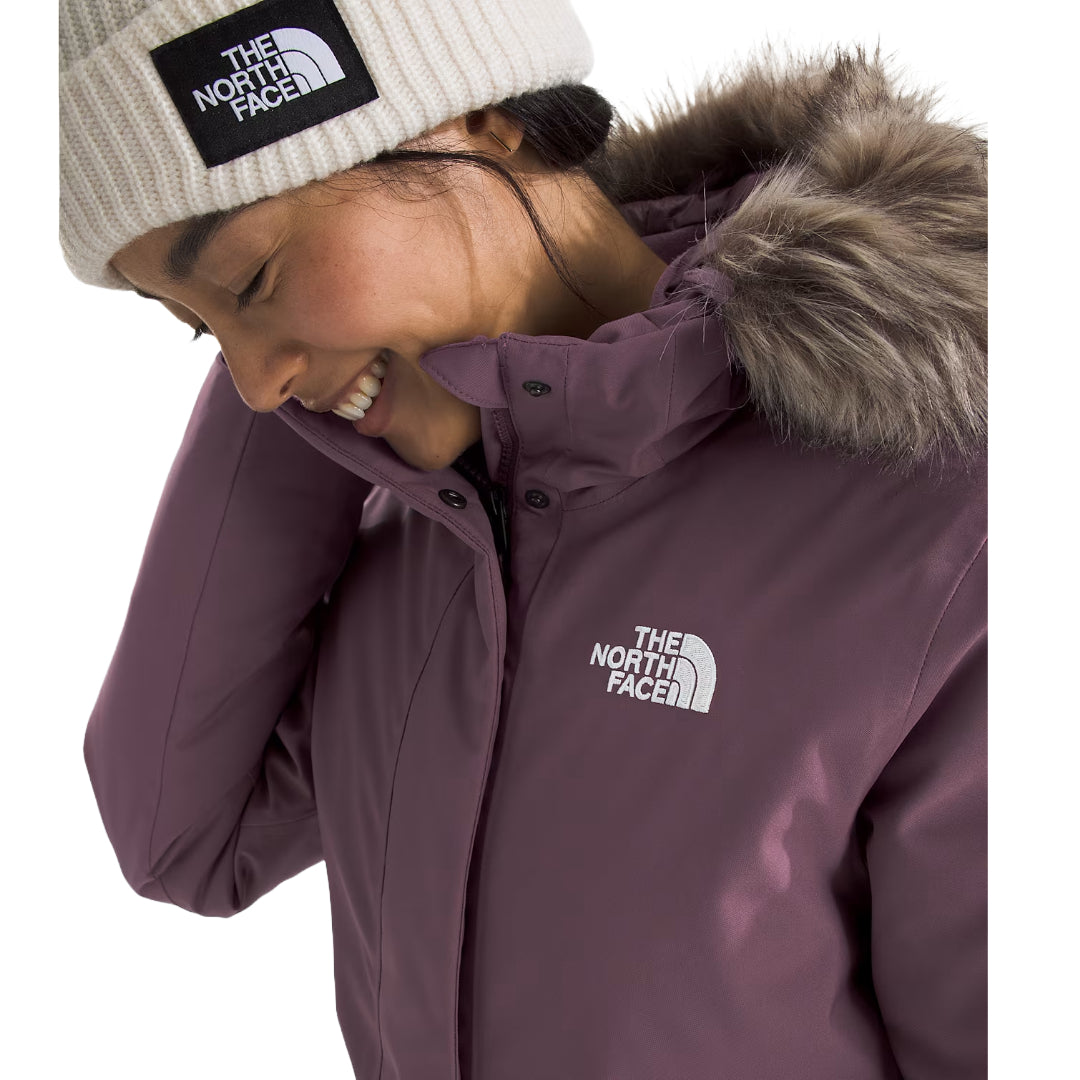"The North Face Women's ARC Parka, lightweight waterproof jacket with a modern design, providing protection from rain and wind